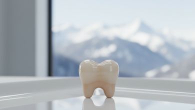 A close-up, photorealistic image of a perfectly crafted, pristine white ceramic dental crown resting on a sterile, reflective surface. The background is a softly blurred view of a modern dental clinic interior with a distant, out-of-focus view of snow-capped mountains through a window, signifying Switzerland.