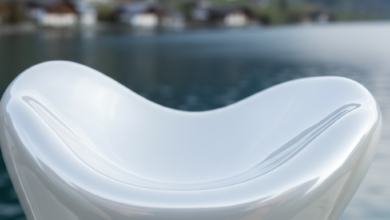 A pristine, abstract white surface, perfectly smooth and curved to suggest dental precision and aesthetic beauty, against a soft-focus background of a traditional Swiss village and a tranquil lake surrounded by mountains.