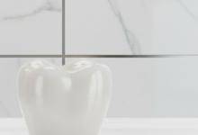 A photorealistic, ultra-detailed close-up of a perfect, naturally translucent white dental crown, showing a subtle sheen. The background is softly blurred, hinting at a modern, high-end clinic interior or a sophisticated Swiss setting. No visible text.