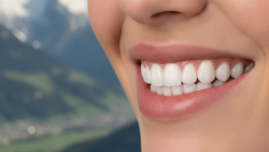 Close-up of a person's healthy, bright white smile with perfectly aligned teeth, showcasing the results of composite bonding. In the softly blurred background, the iconic Swiss Alps are visible under clear skies.