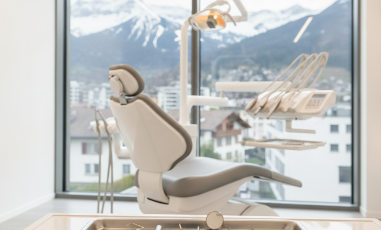A clean, modern dental clinic room with advanced instruments on a tray in the foreground and a comfortable dental chair in the mid-ground. Through a large window, a blurred view of a Swiss city and mountains is visible in the background, conveying high-quality dental care in Switzerland.